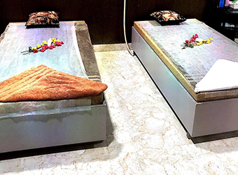 2 beds and towels in rainbow massage center Karachi